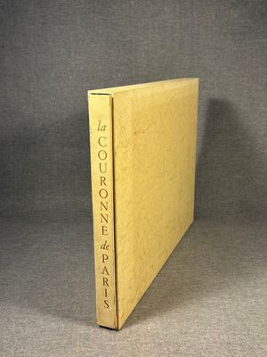 an open book sitting on top of a table next to a gray background