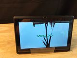 a laptop that is sitting on a wooden table