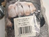 a loaf of bread wrapped in plastic on a counter