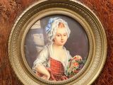 a picture of a young girl holding a basket of flowers