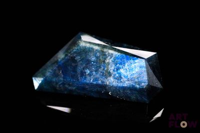an image of a blue stone on a black background