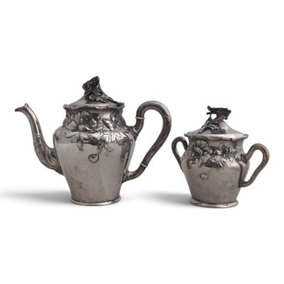 two silverplated teapots and a sugar and creamer