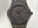 an image of a wrist watch with a black dial and brown leather strap