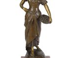 bronze statue of a woman holding a basket on a marble base