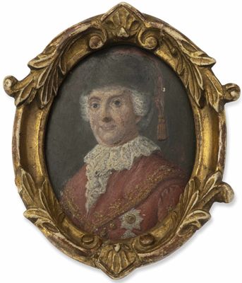 une vieille photo d'un homme vêtu d'un manteau rouge et d'un chapeau