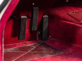 an image of a car ' s interior with red carpet