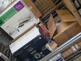 many boxes and packages stacked on top of each other