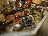 a table with a lot of pots and pans on it