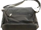 a black purse with a white tag on it