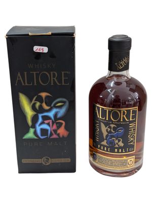 an image of a bottle of alcohol sitting next to a box