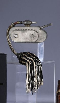 a glass display case with a metal object on it