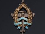 a close up of a medal with a cross on it