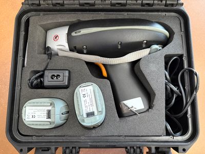 a black case with a hair dryer and other items in it