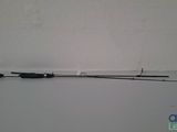a close up of a fishing rod on a table near a wall