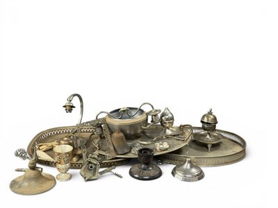 a pile of silver objects on a white surface
