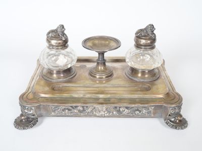 two salt and pepper shakers sitting on a tray