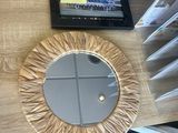 a table with a mirror and a tablet on it