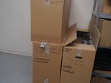 several boxes stacked on top of each other in a room