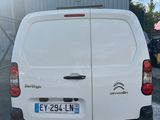 a white van that is parked in a parking lot