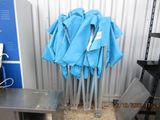 a blue umbrella that is on a stand in a room