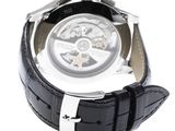 the watch is black with a white face and a black strap
