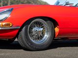 an image of a red sports car parked in a parking lot