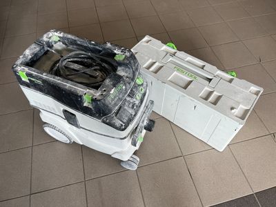 an overhead view of a toilet in a tiled bathroom