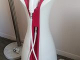 an image of a white and red hair dryer in a room
