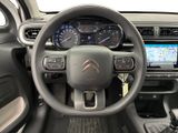 the interior of a car with a steering wheel and dashboard controls