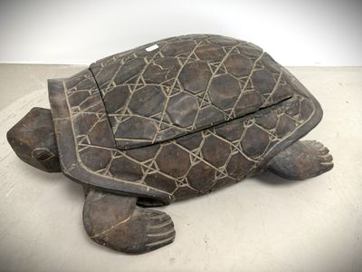 an image of a wooden turtle sitting on top of a white surface