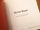 a book with a picture of a man on it on a table