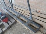 some wooden pallets and a red fire hydrant sitting on top of them