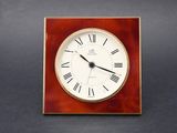 clock with roman numerals on a dark background