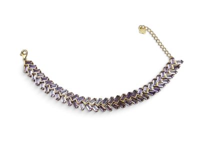 a close up of a purple and gold necklace on a white background