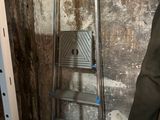 a ladder that is leaning against a wall in a room