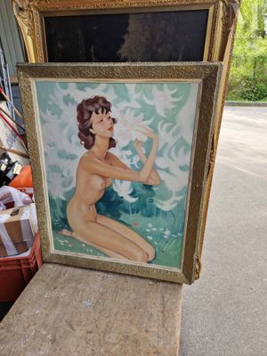 une photo d'un tableau représentant une femme assise sur une table