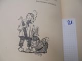un livre sur lequel figure le dessin d'un homme et d'un chien