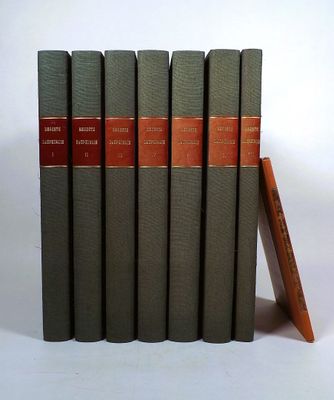 five books are stacked on top of each other on a white surface