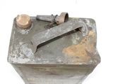 an old metal box with a rusty handle on a white surface