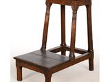 an old wooden step stool sitting on top of a white floor