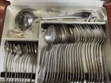 many spoons and spoons in a box on the table