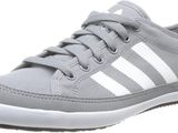 a close up of a pair of grey and white shoes