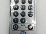 a remote control in a plastic bag on a table