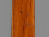 a wooden clock that is on display on the wall