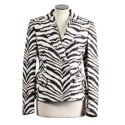 the jacket is black and white with a zebra pattern on it