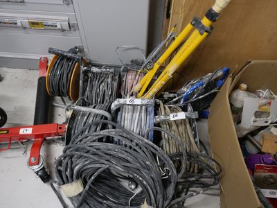 a pile of wires and tools in a box