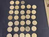 a lot of coins that are on the table