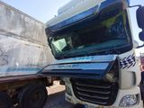 a semi truck that is parked next to another semi truck