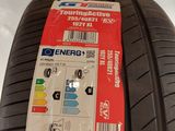 a close up of a tire on a white surface with a sticker on it
