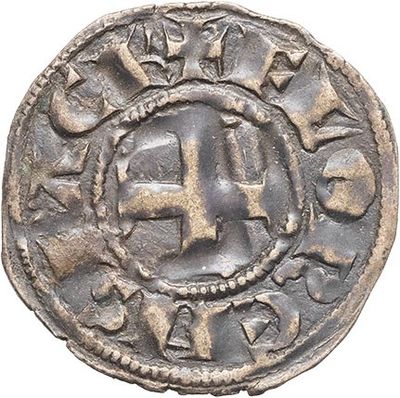 a silver coin with a cross on the front of it